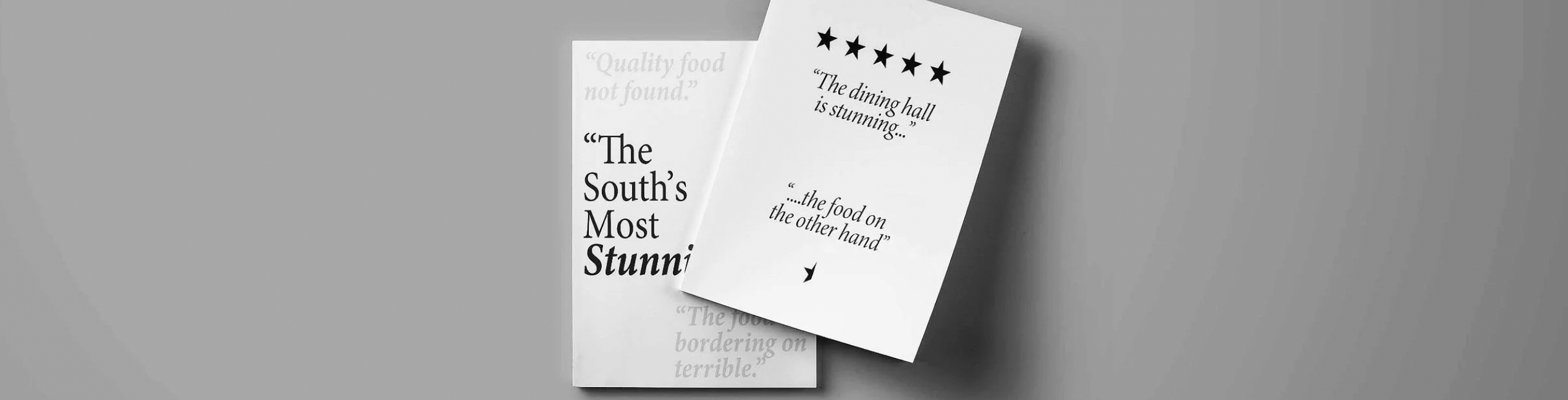 Two printed booklets of The South's Most Stunning photographed on a grey surface, showing the front and back covers.